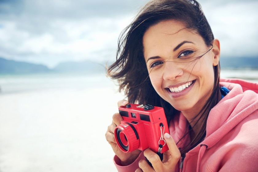 Girl with a Lomo camera | Skylum Blog