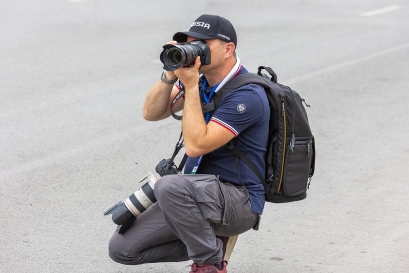 A photographer takes a photo | Skylum Blog