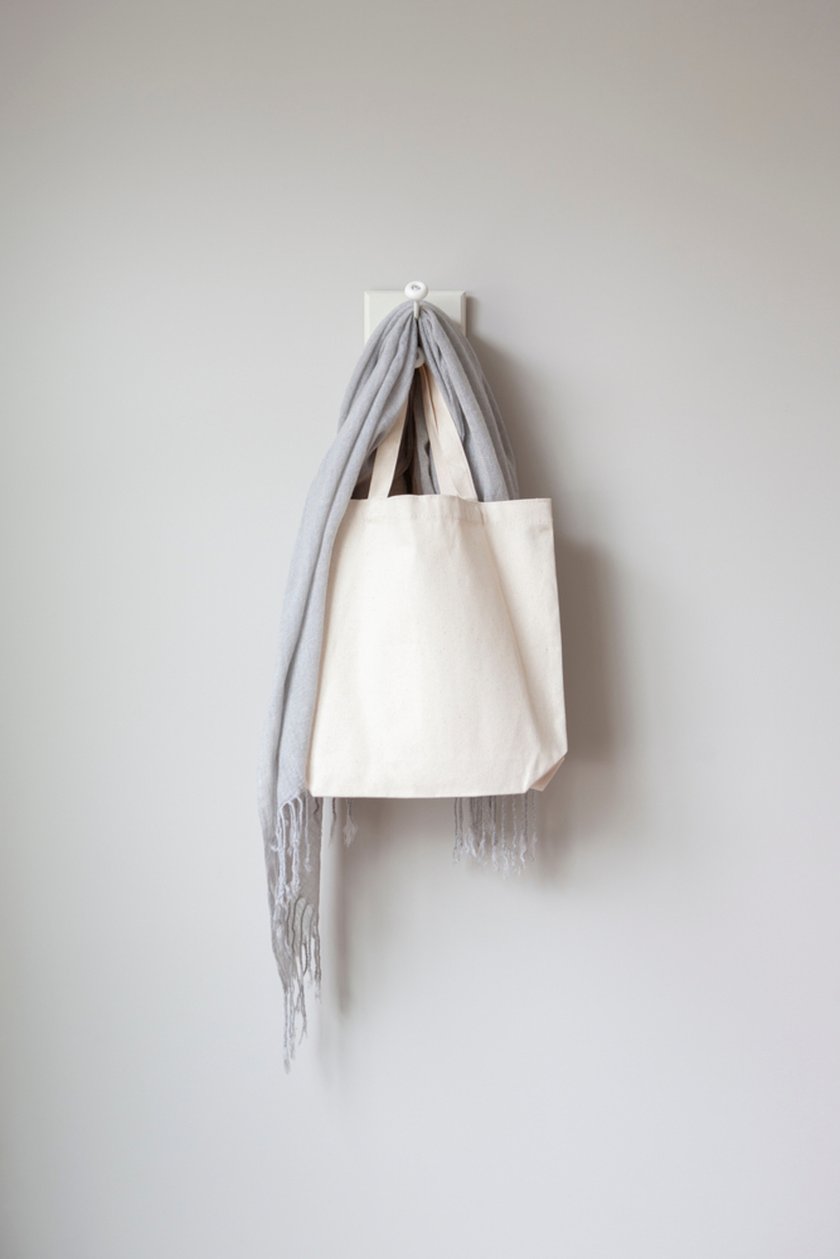 A scarf and a bag are hanging on a hook | Skylum Blog
