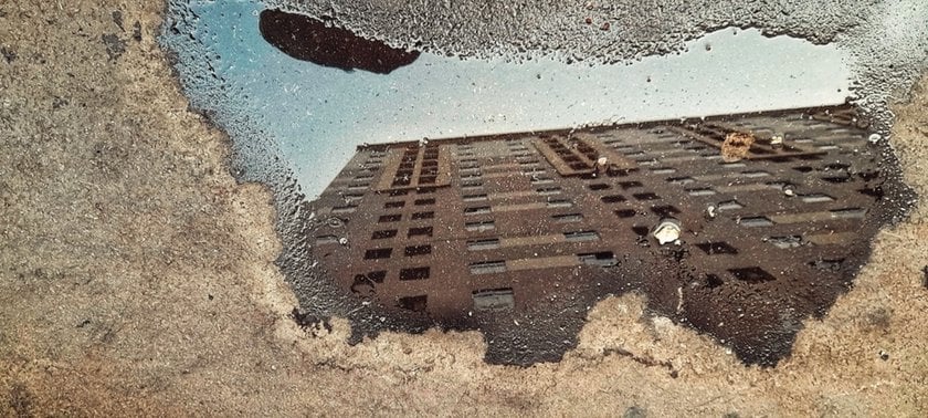 Reflection of a house in a puddle | Skylum Blog