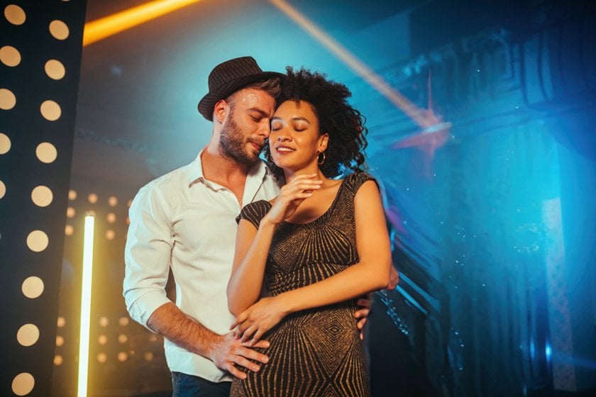 A couple on a dance floor with no people in the background | Skylum Blog