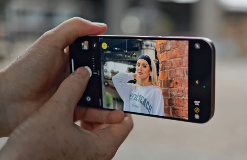 A man takes a photo using Portrait mode on an iPhone | Skylum Blog