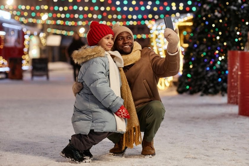 Dad and Daughter Taking a Winter Photo Together | Skylum Blog