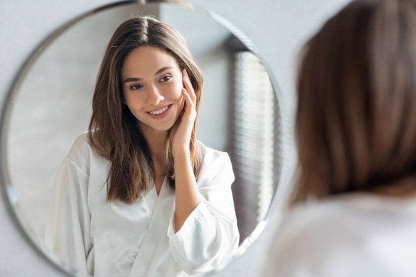 Photo of a girl looking in the mirror | Aperty Blog
