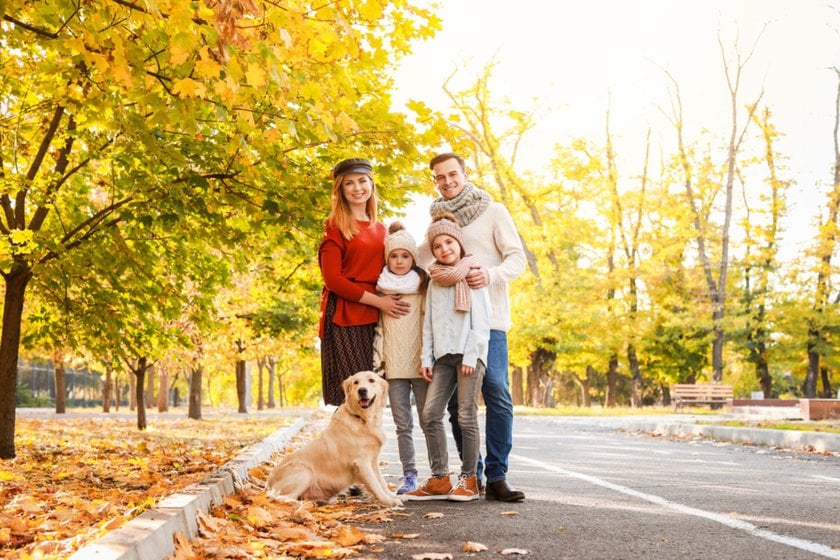 A family with a dog on the street in autumn | Aperty Blog
