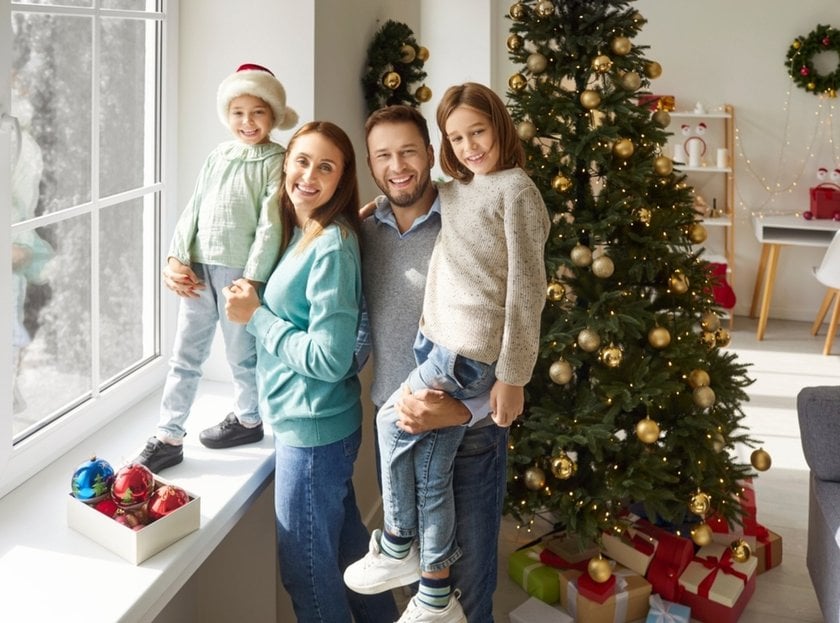 Photo of a family at a window indoors in winter | Aperty Blog