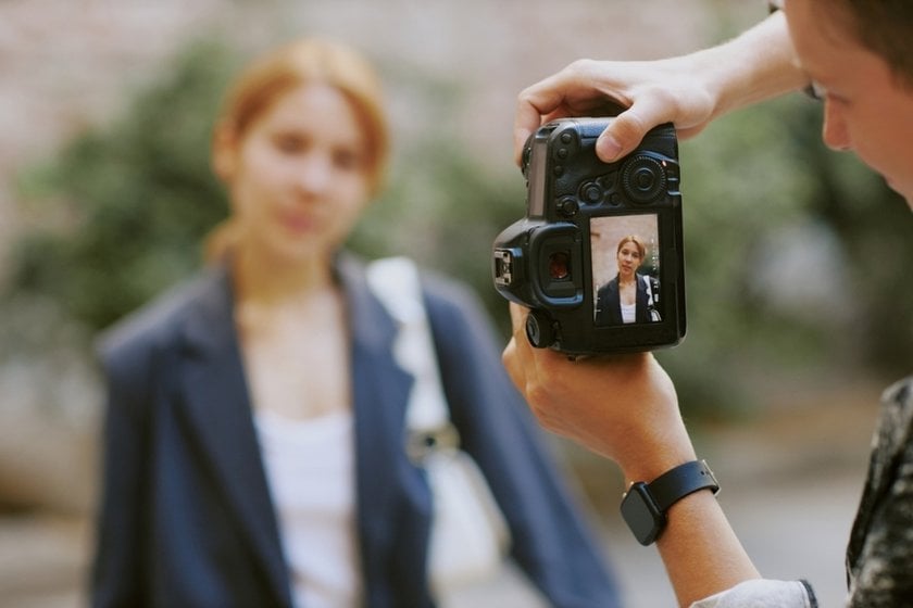 A photographer takes a portrait | Aperty How To