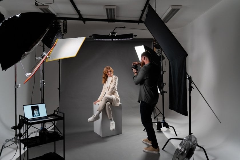 A photographer takes a portrait in a studio | Aperty How To