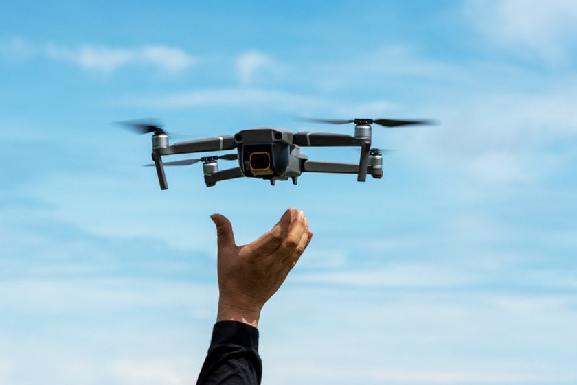 A man's hand and a drone | Skylum Blog