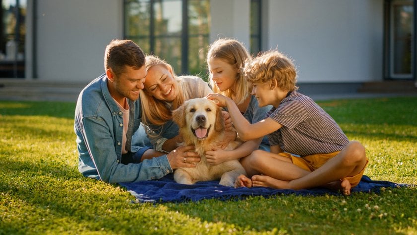 A family on the street with a dog | Skylum Blog
