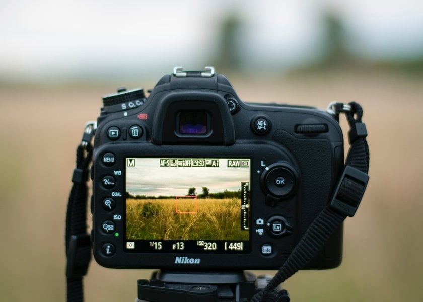 Camera Capturing a Picture of a Scenic Field | Skylum Blog