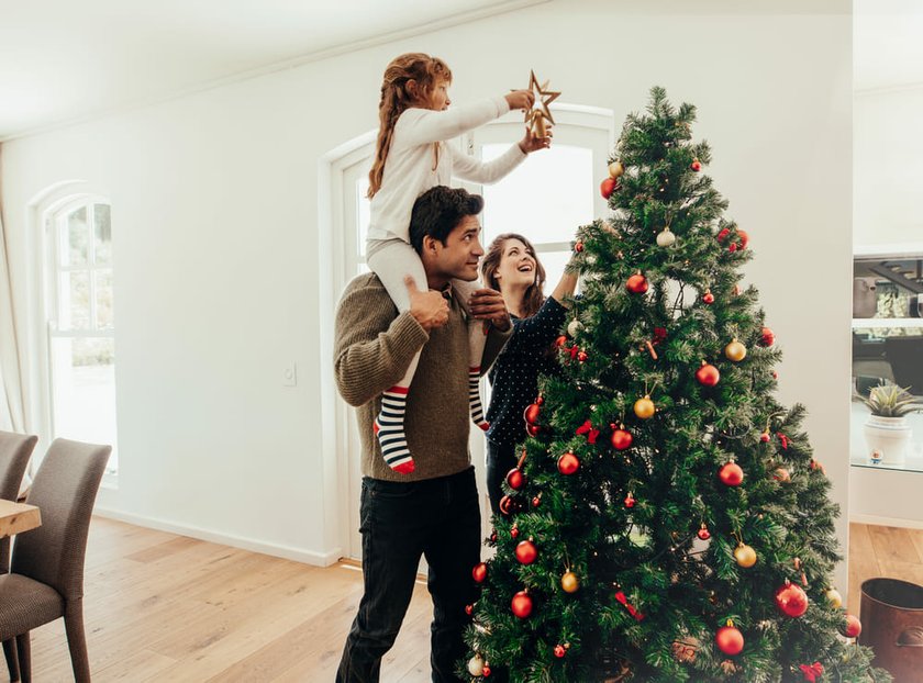 Happy Family Decorating a Christmas Tree | Skylum Blog