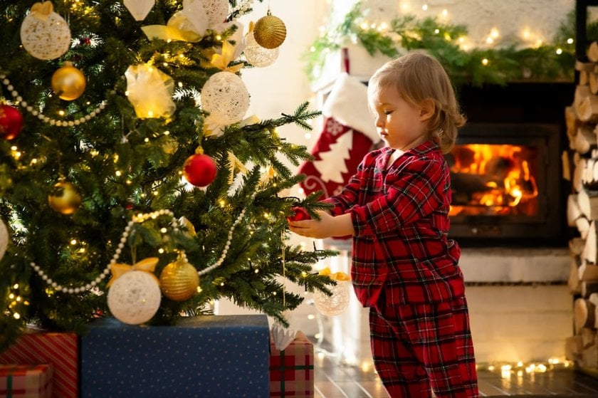 Child in Front of Christmas Decorations | Skylum Blog