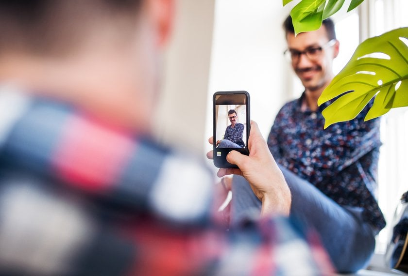 Photographer Capturing a Portrait of a Man | Skylum Blog