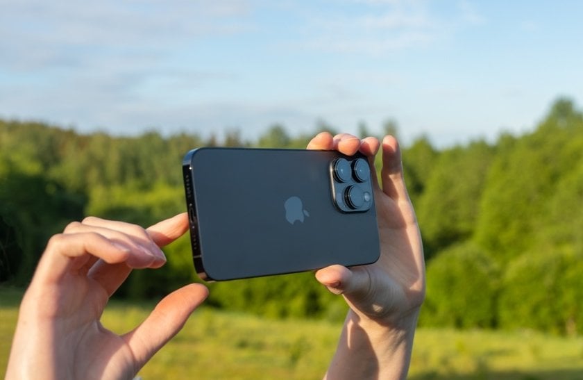 Man takes a photo on iPhone | Skylum How To