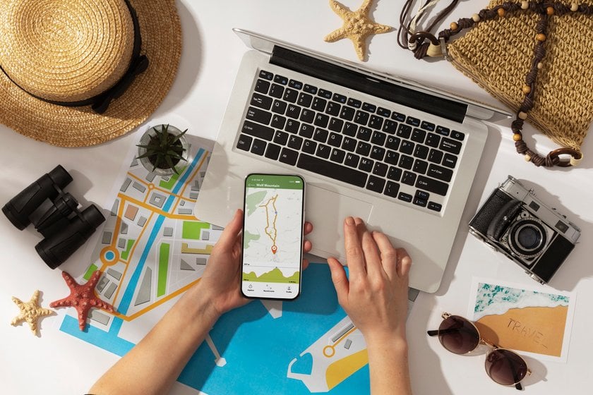 A man with a phone in his hands is preparing for a trip | Skylum Blog