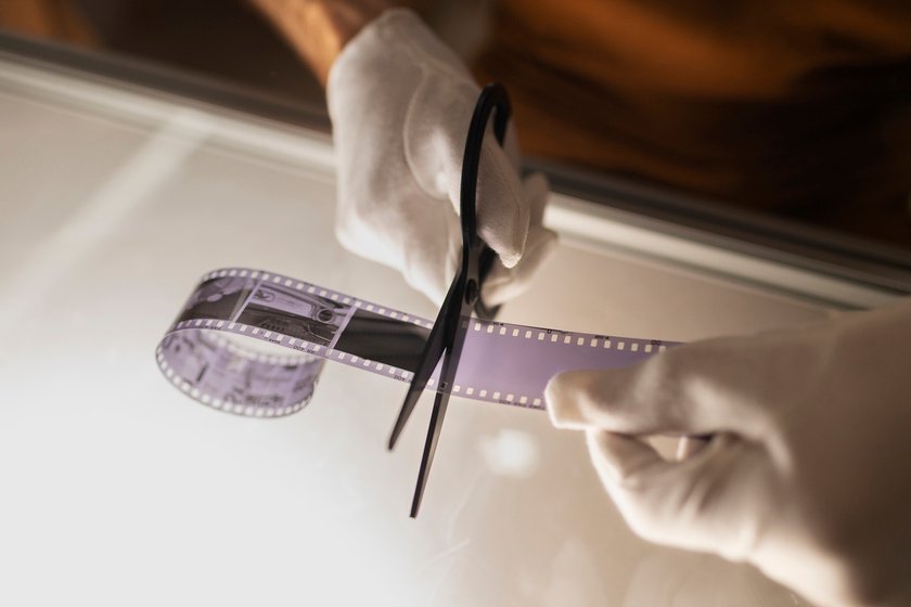 A man cuts a photographic film | Skylum Blog
