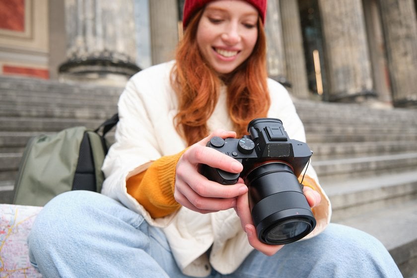 Photographer on the steps with a camera in his hands | Skylum Blog