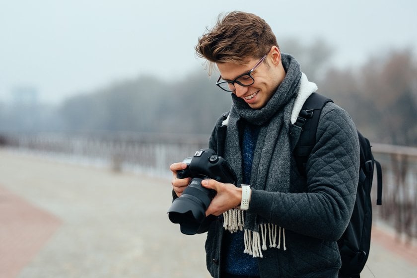 Photographer with camera in hands | Skylum Blog
