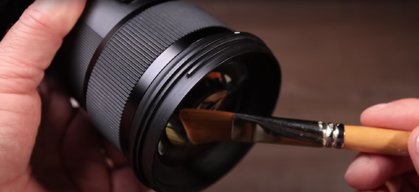 Cleaning the front of the lens with a brush | Skylum Blog