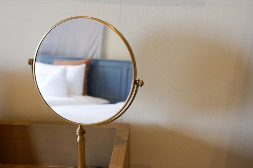 Reflection of a bed in a mirror | Skylum Blog