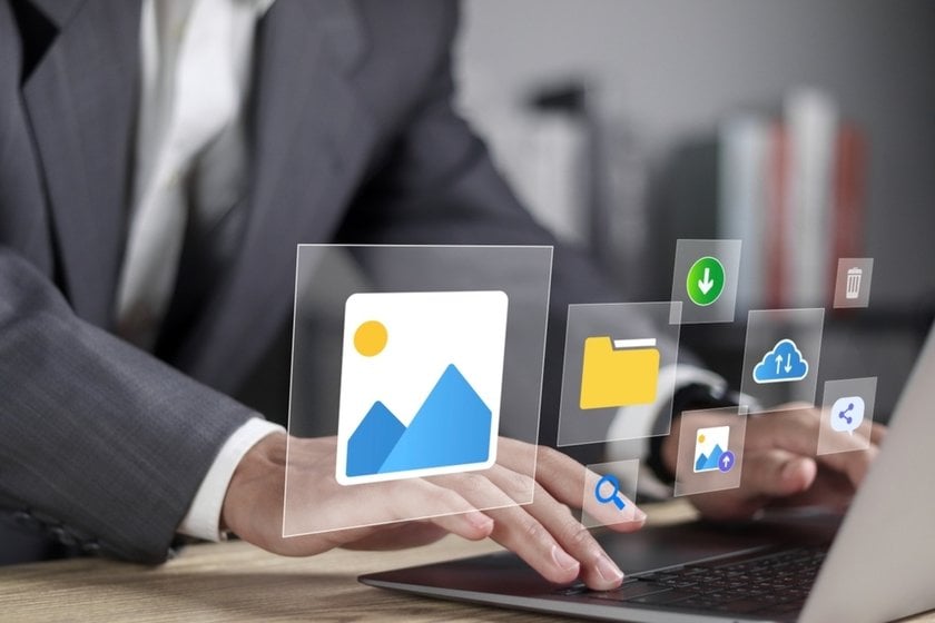 Photo and folder icons on a laptop in the air | Skylum How-to