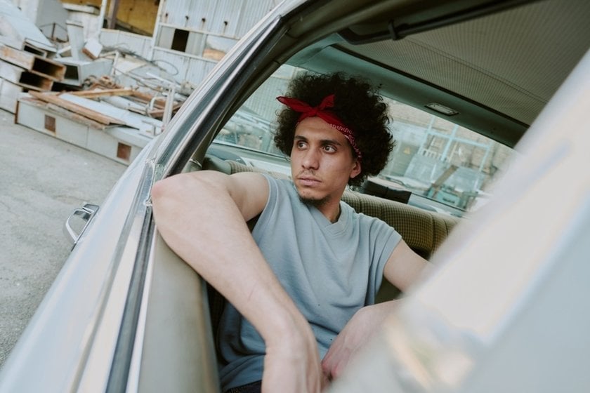 Photo of a guy in a car with a tilt | Skylum Blog