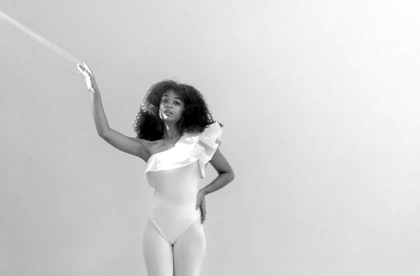 Girl in a white bodysuit | Skylum Blog