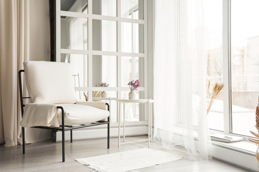 A chair opposite the window | Skylum Blog