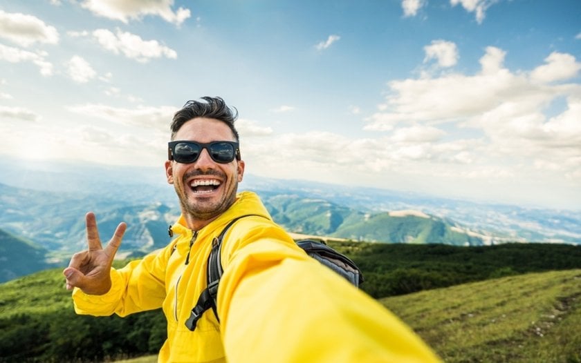 A guy's selfie against a natural backdrop | Skylum Blog