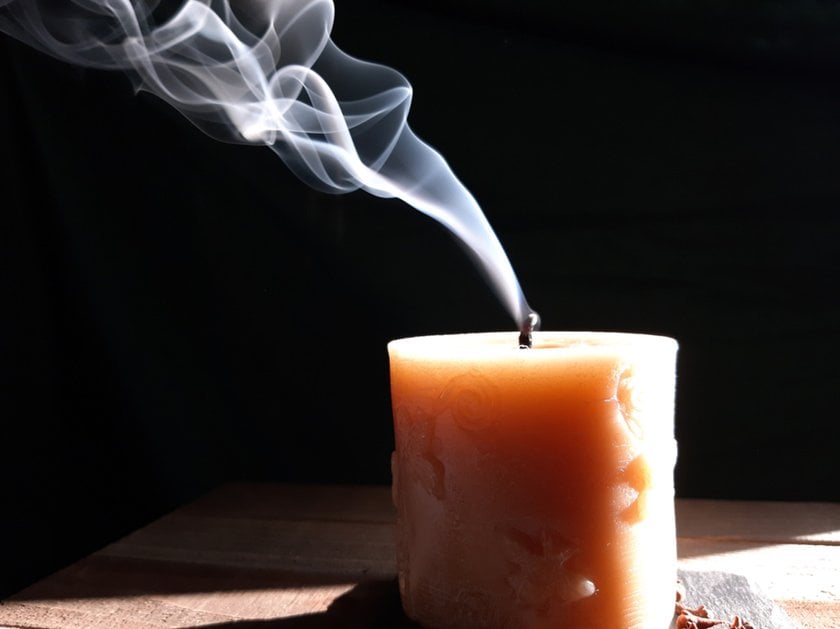 An extinguished candle with smoke | Skylum Blog