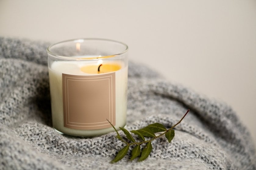 A lit candle in a glass | Skylum Blog