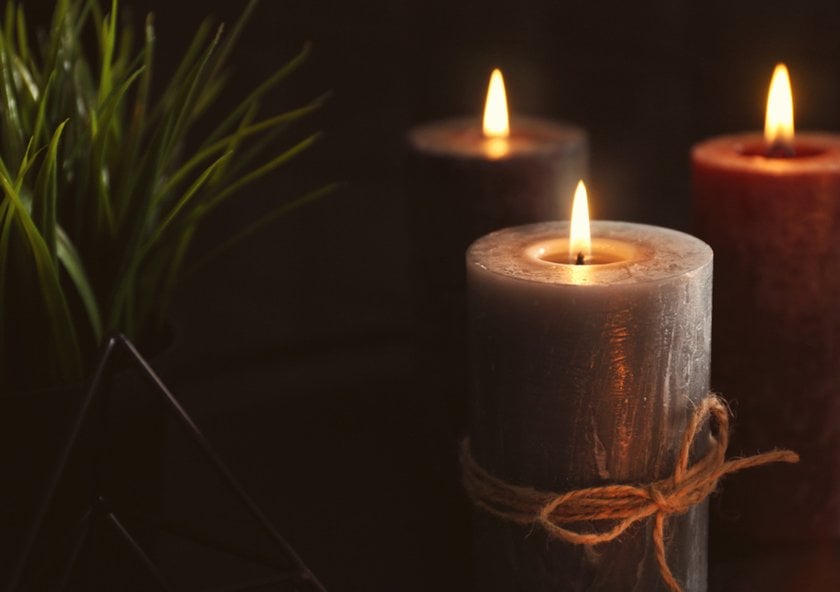 Lit gray candles with strings | Skylum Blog