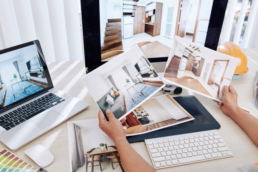 Photos of real estate on a table and on a laptop screen | Skylum Blog