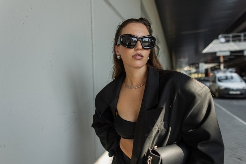 Portrait of a girl wearing glasses on the street | Skylum Blog