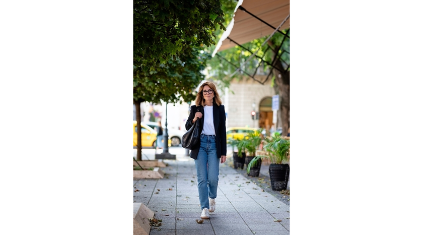 A photo of a woman walking down the street | Skylum Blog