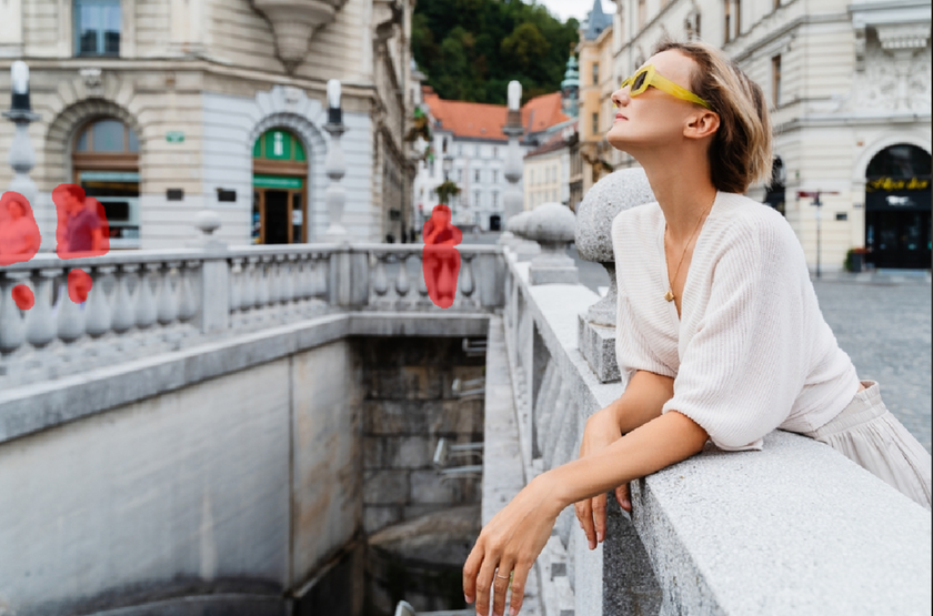 A photo of a girl on the street with passersby | Skylum Blog
