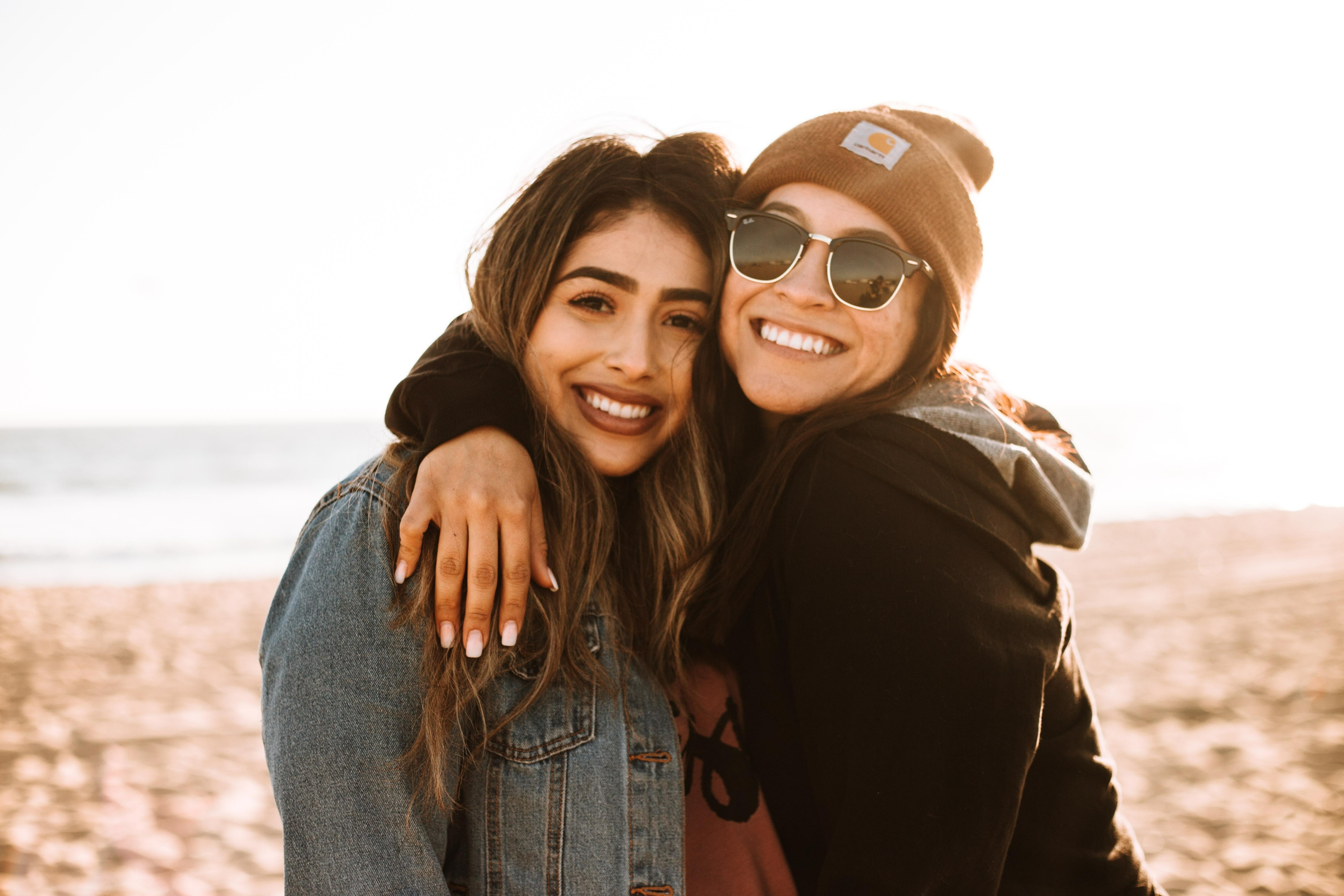 Free Photo | Cute family portrait of two sister womanâ€™s hugs and smile,  lifestyle studying portrait, trendy hipster outfits, relations concept,  natural beauty, happy together.