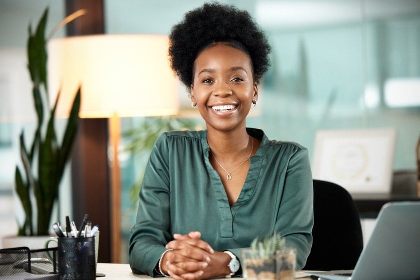 Portrait of a woman at her desk | Skylum Blog