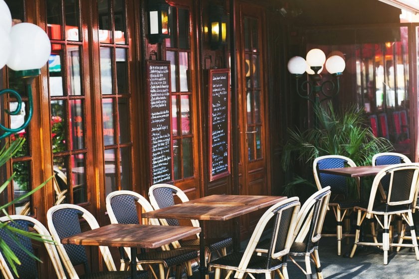 Photo of tables near a cafe on the street | Skylum Blog