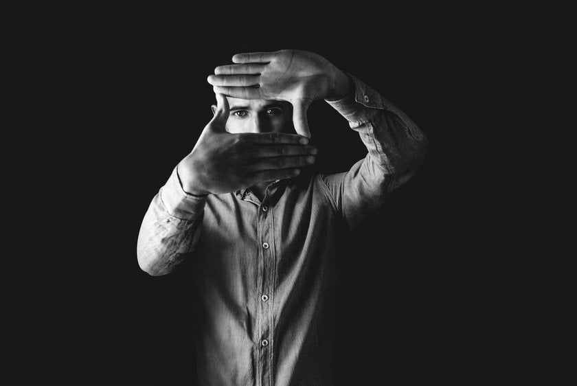 The man cupped his hands like a camera | Skylum Blog
