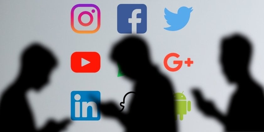 Social networks on the wall and shadows of people | Skylum Blog