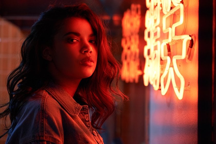 Serious Girl Near a Neon Red Sign | Skylum Blog