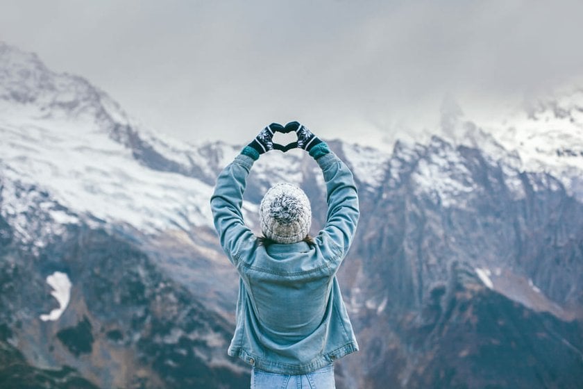 Photo of a Girl Against the Backdrop of Winter Mountains | Skylum Blog