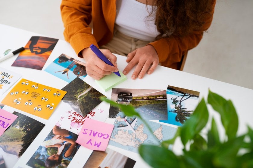 A girl looks at photographs and postcards | Skylum Blog