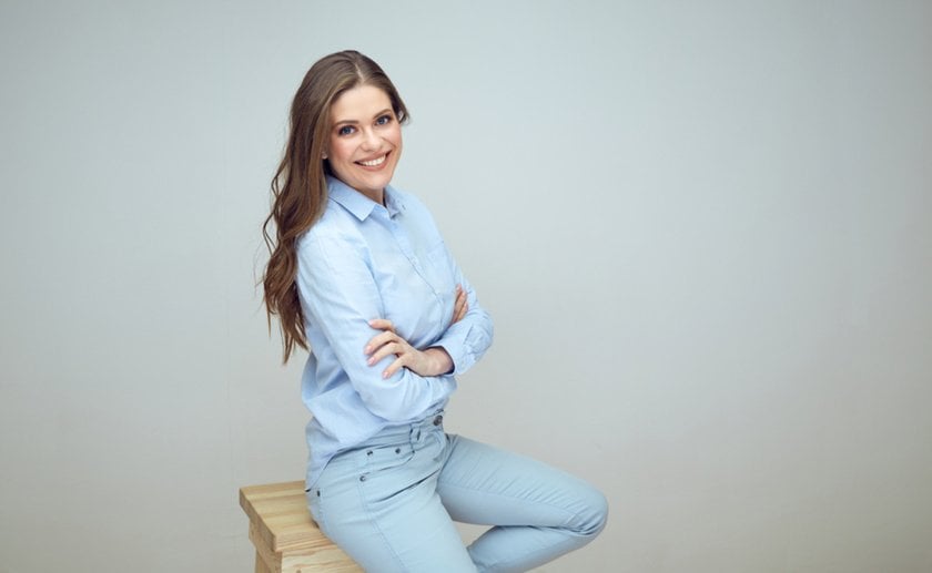 Portrait of a girl on a chair in a studio | Skylum Blog