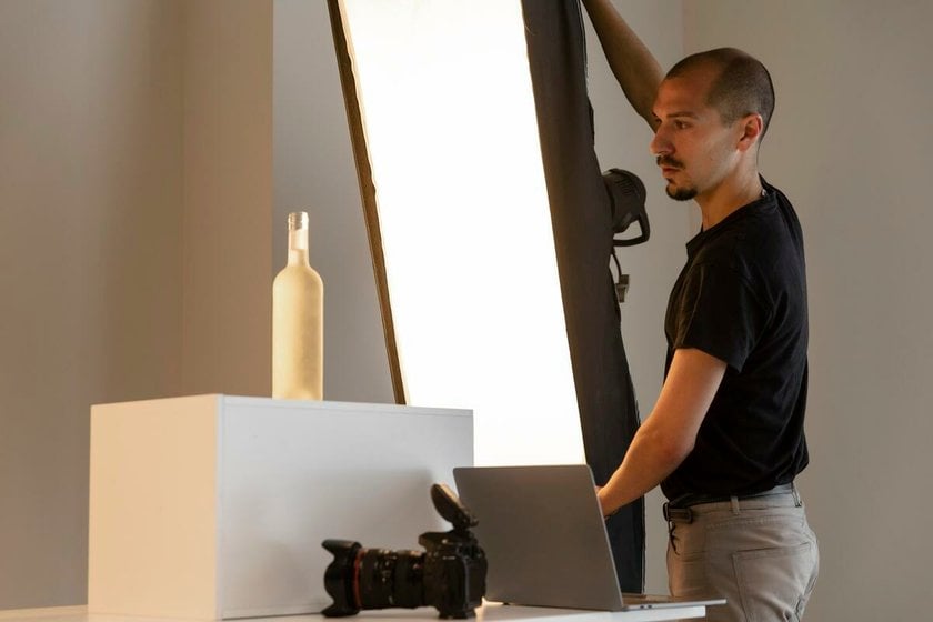 Photographer adjusts lighting for photo | Skylum Blog