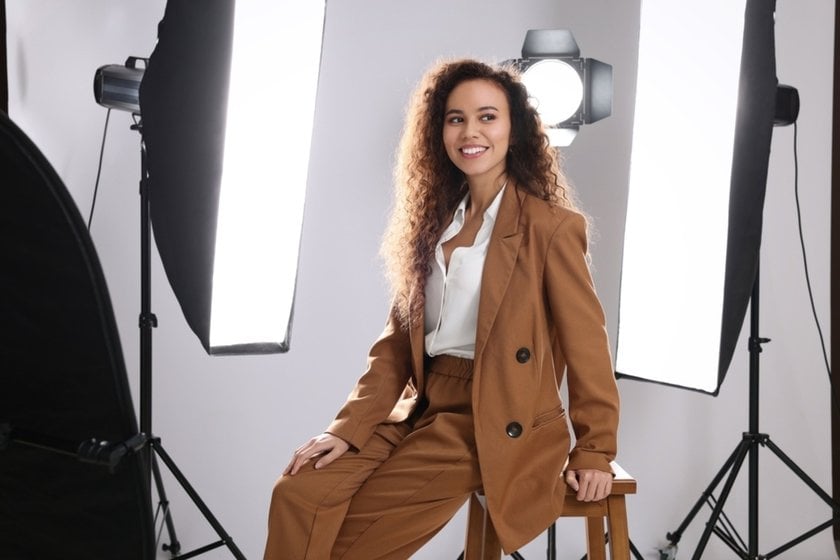Model on a chair near studio lighting | Skylum Blog