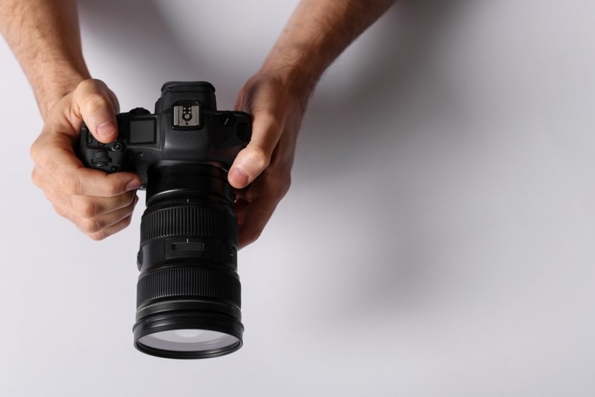 A camera in a man's hands | Skylum Blog