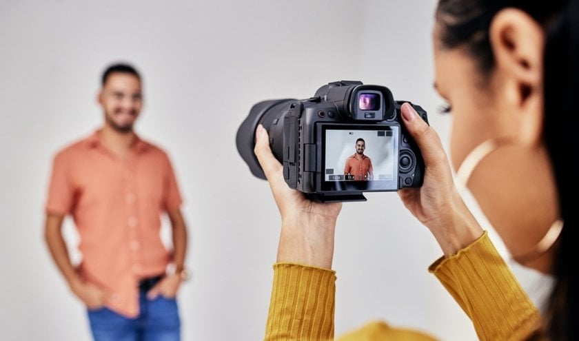 A photographer takes a portrait of a man | Skylum Blog